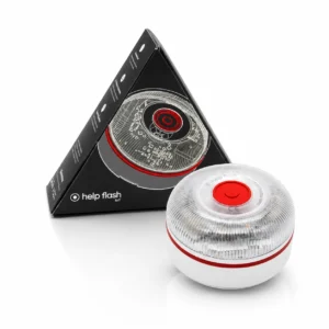 Baliza de emergencia V16 conectada a DGT 3.0 de la marca Help Flash modelo IoT, mostrada junto a su original caja negra en forma de triángulo.